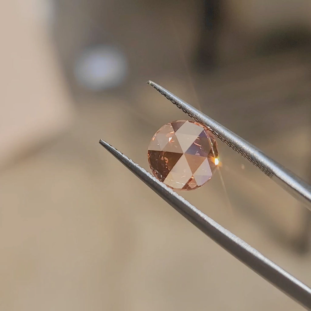 "Sunlight video showcasing 2.53ct round rose cut's vivid pink hue and floral faceting"