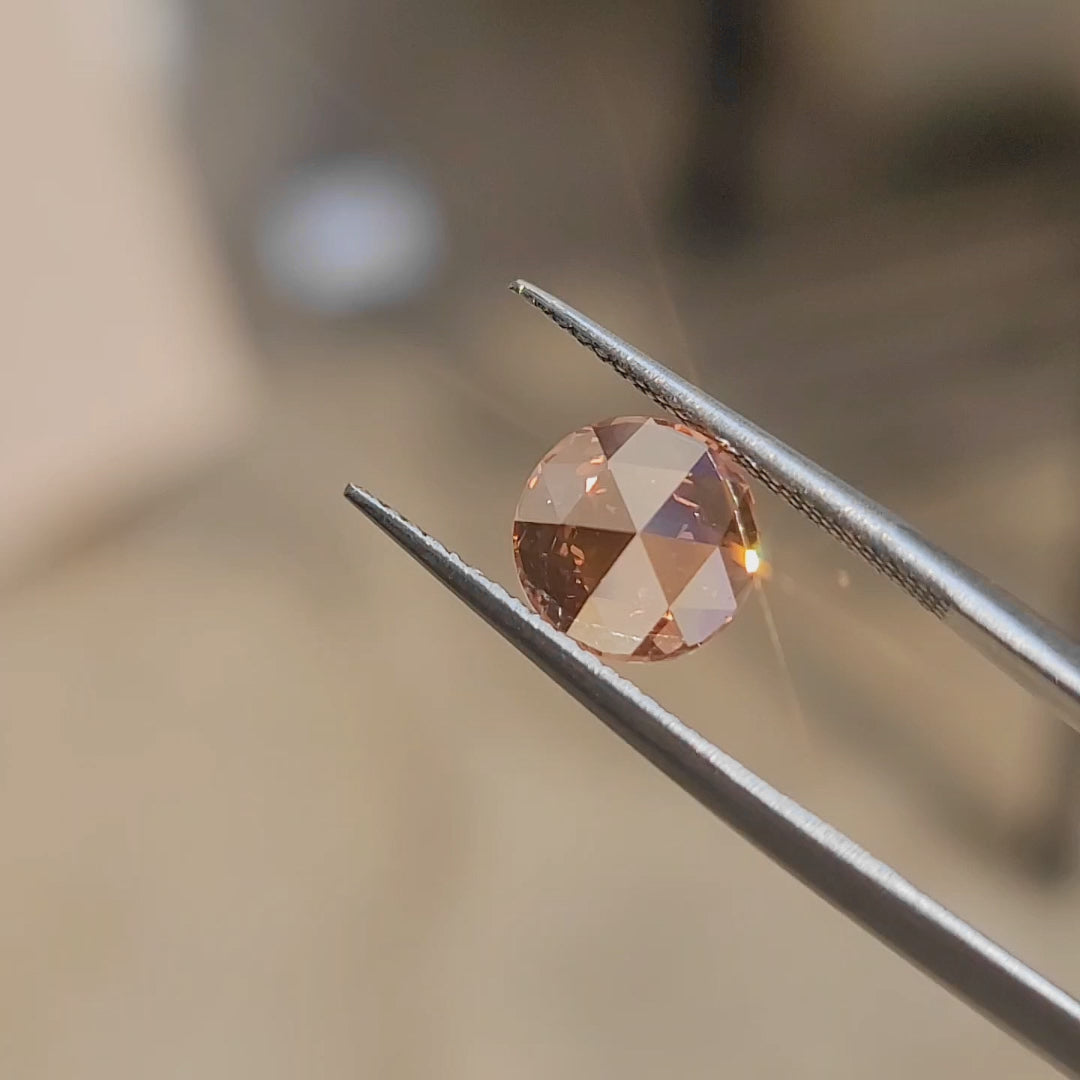 "Sunlight video showcasing 2.53ct round rose cut's vivid pink hue and floral faceting"
