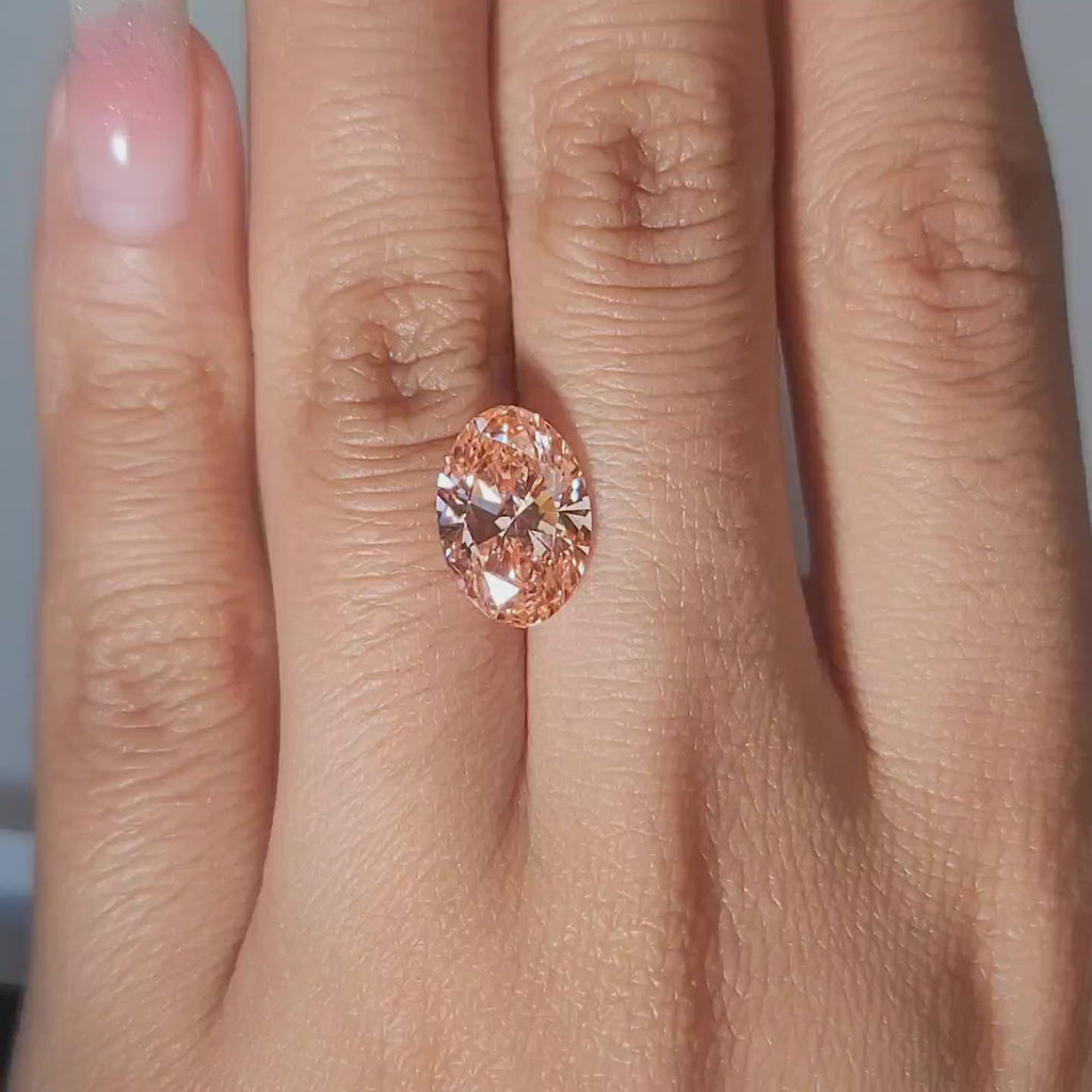 3.52ct Oval vivid pink diamond in cozy ambient light