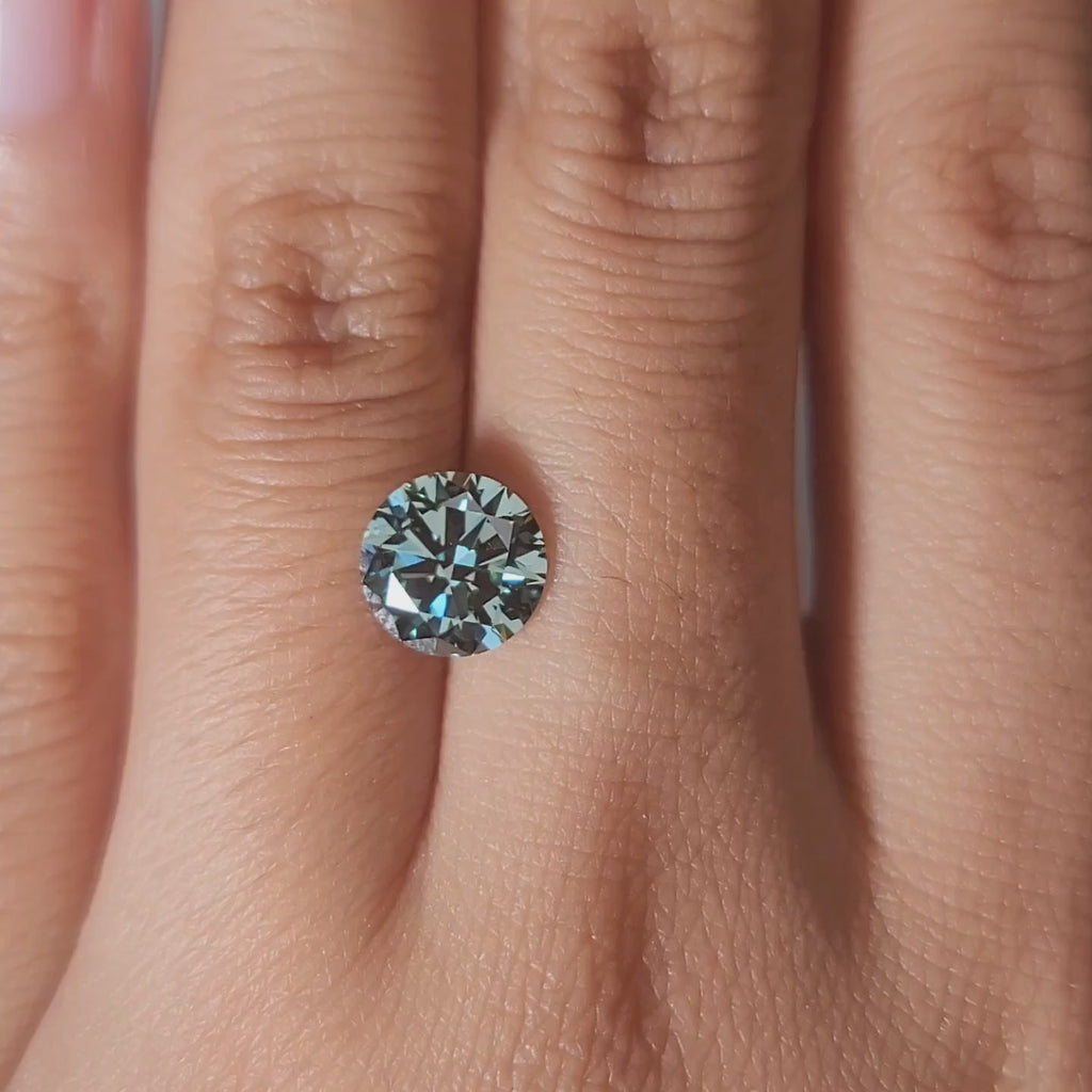 "Comparison video showing 2.00ct green diamond's color shift in different lighting"