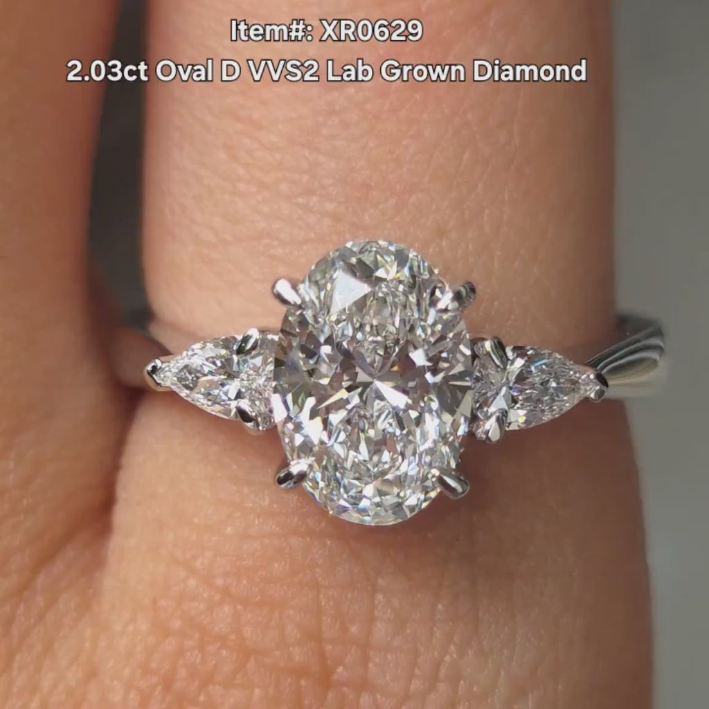 DovEggs oval and pear lab diamond three stones engagement ring video