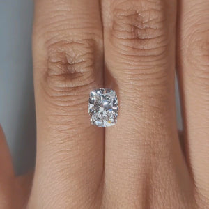 Hand-modeled video of 1.52ct cushion diamond in warm indoor glow
