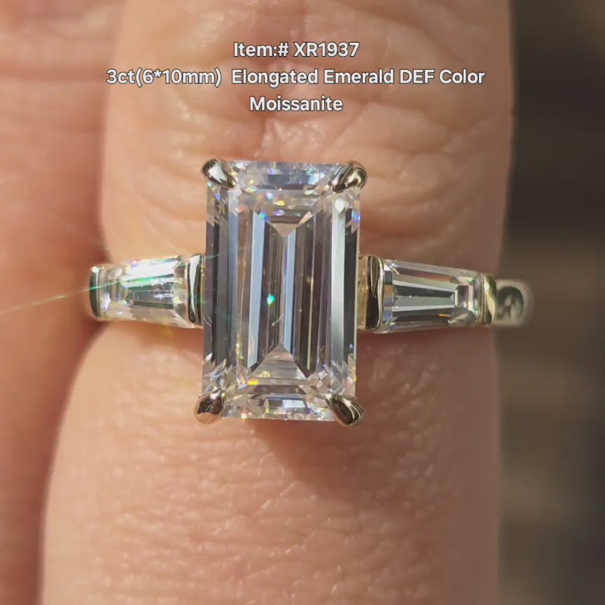 DovEggs Elongated Emerald moissanite ring sparkling in sunlight video.