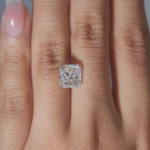Statement ring video of 3.02ct radiant diamond in warm glow