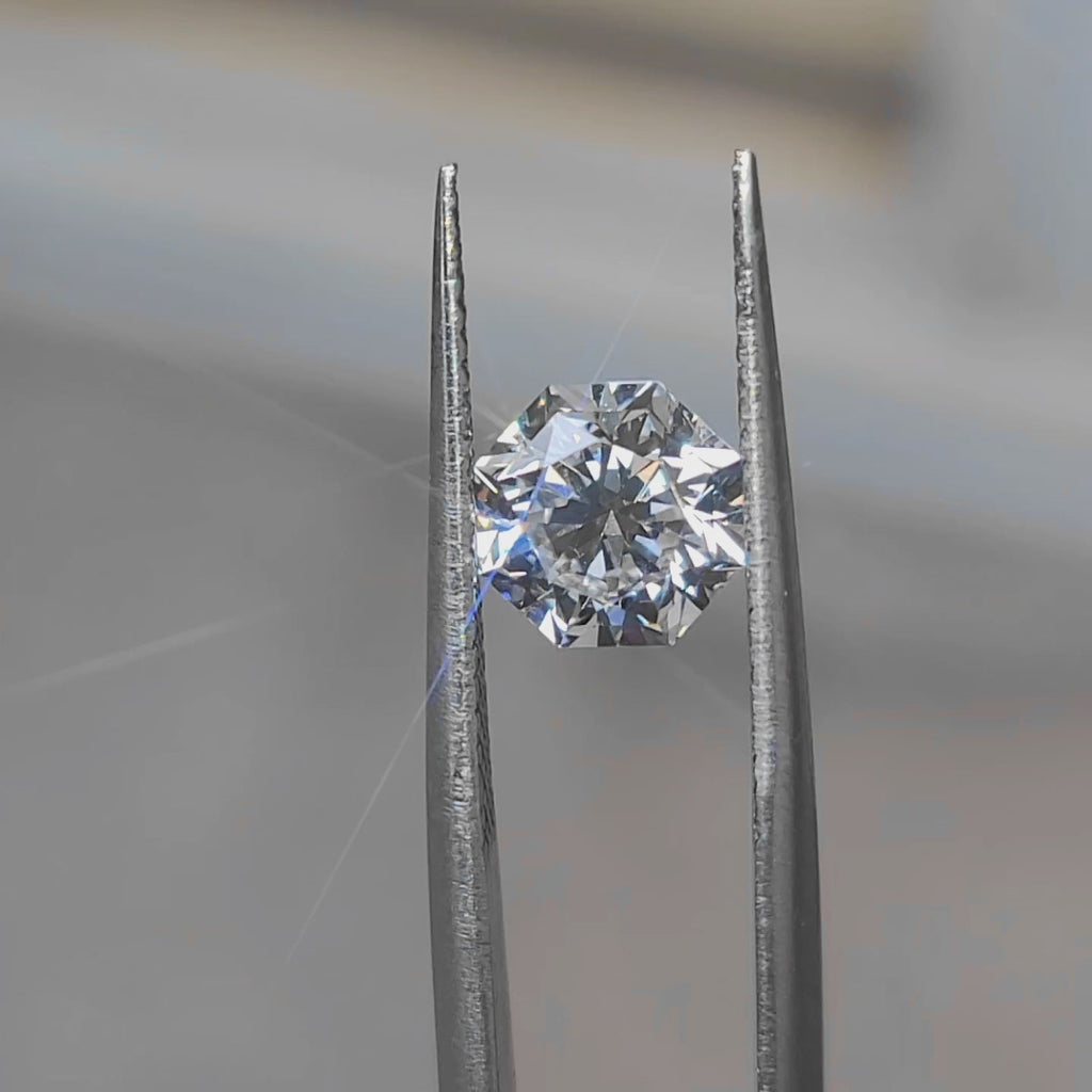 "Sunlight video showing 2.111ct modified octagon cut diamond's geometric facets"