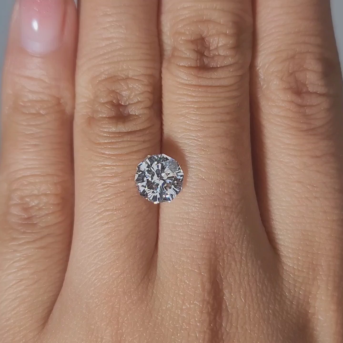Side-by-side hand comparison with natural diamond