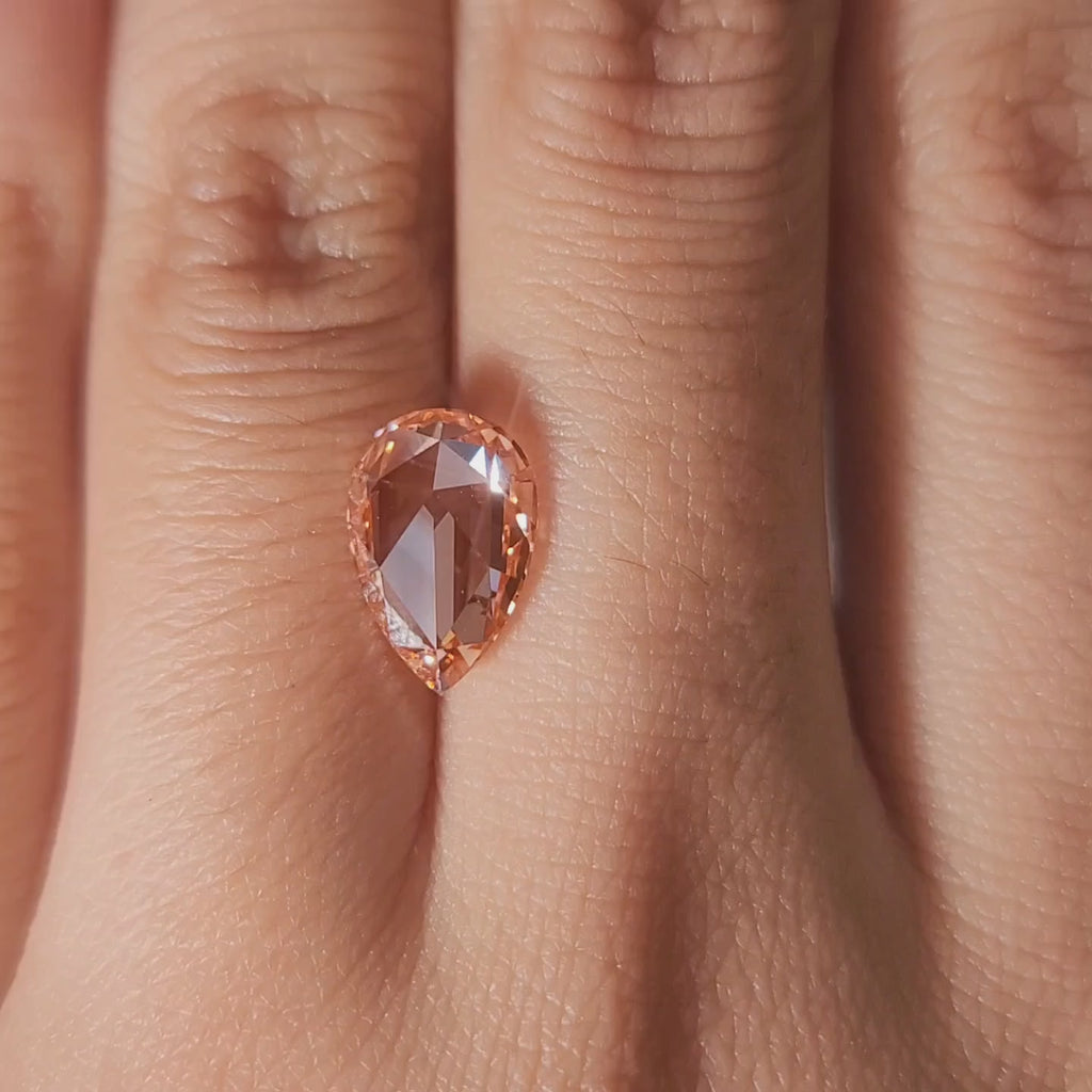 “Hand-worn video showing 2.21ct pink pear rose cut in romantic lighting"