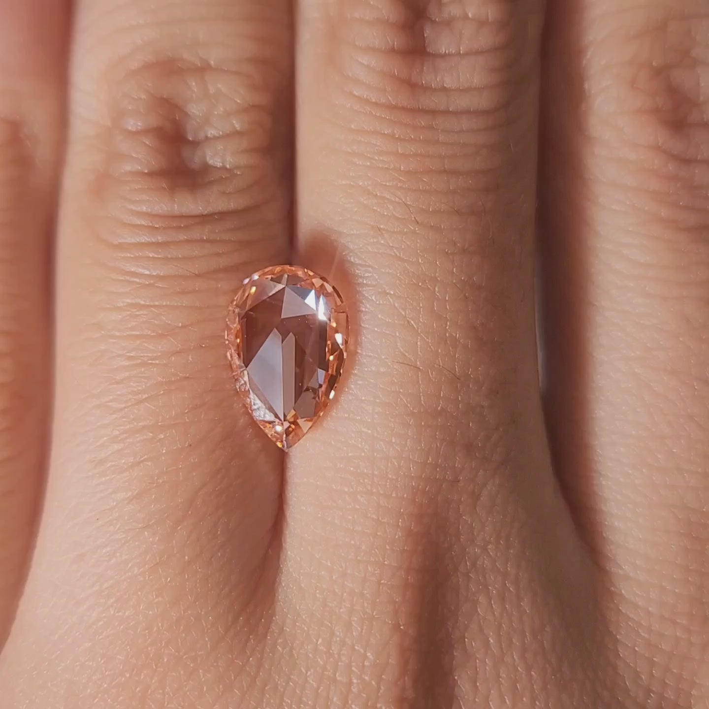 “Hand-worn video showing 2.21ct pink pear rose cut in romantic lighting"