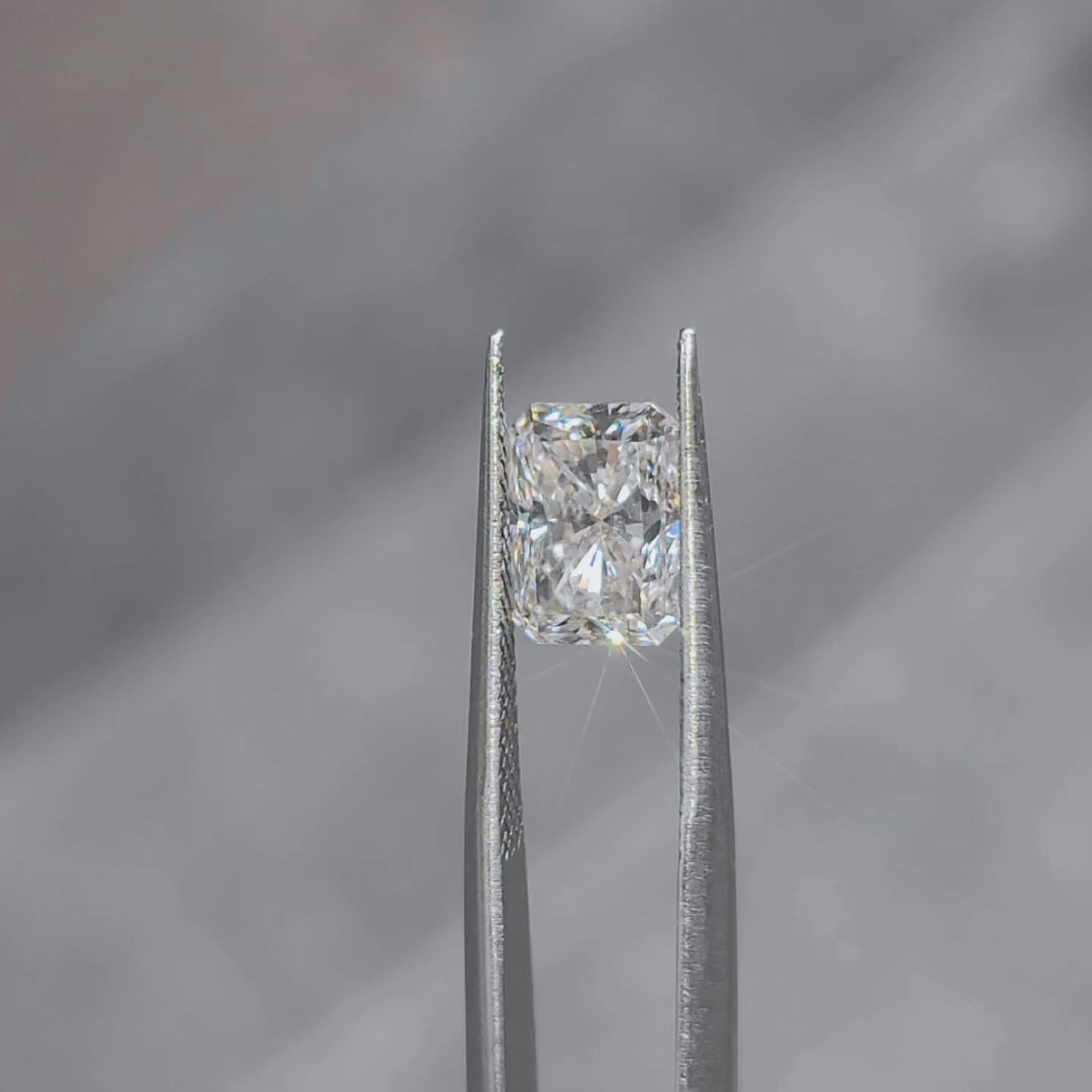 3.07ct radiant cut lab diamond sparkling in natural outdoor sunlight, showcasing G color and VS1 clarity
