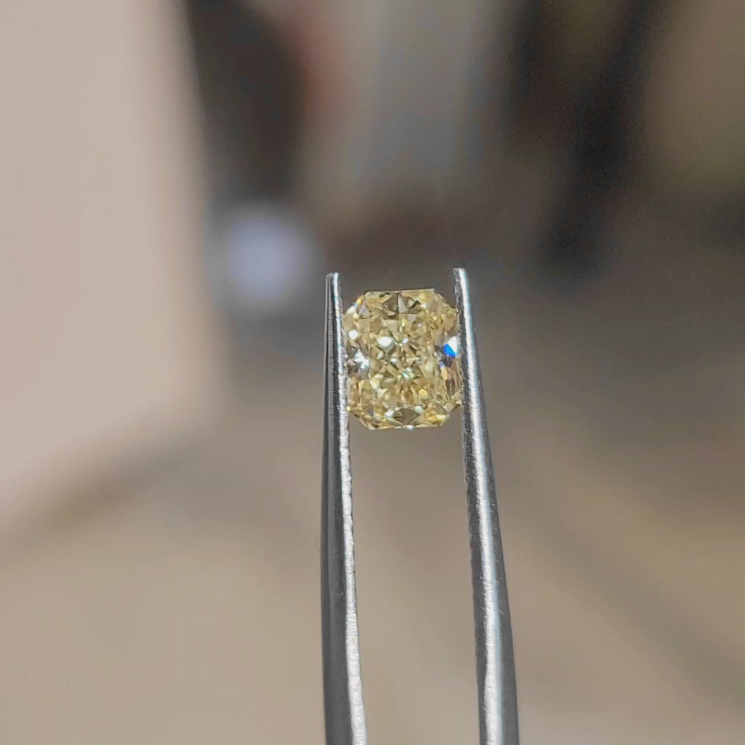 "Sunlit video showcasing 1.00ct radiant cut's vibrant yellow sparkle and crushed ice effect"