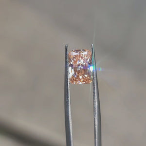 Sunlight video showcasing 2.04ct radiant cut's pink color dispersion