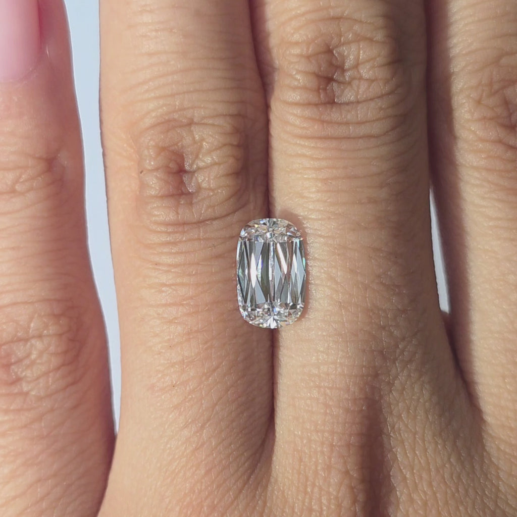 Lab diamond 2.11ct modified elongated cushion brilliant D color VS1 by DovEggs hand modeled in warm indoor light.