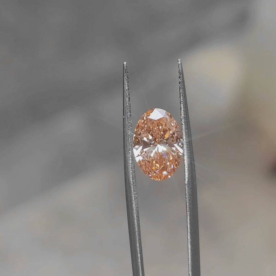 3.06ct Oval pink diamond’s fiery hues under natural daylight
