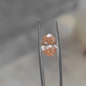 3.06ct Oval pink diamond’s fiery hues under natural daylight