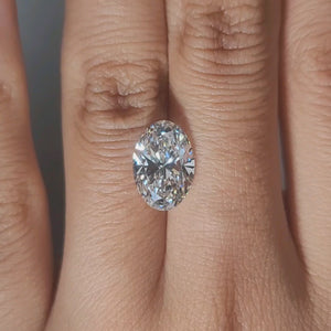 Hand-worn video of 3.37ct oval diamond in warm interior lighting