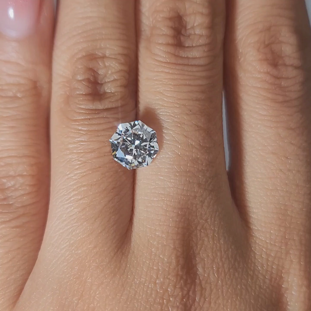 Close-up video of 2.02ct octagon diamond in candlelight, highlighting symmetrical facets