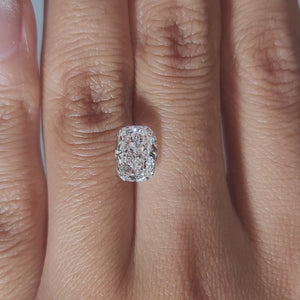"Hand-modeled video of 2.091ct cushion diamond in warm indoor lighting"