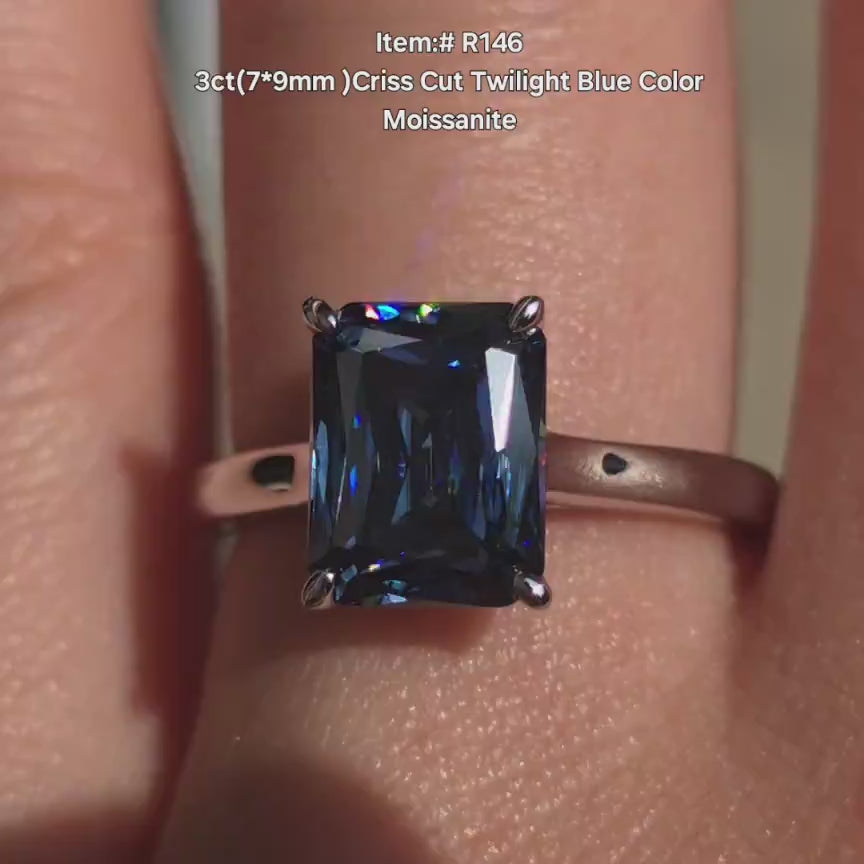 DovEggs solitaire radiant twilight bluemoissanite engagement ring in sunlight