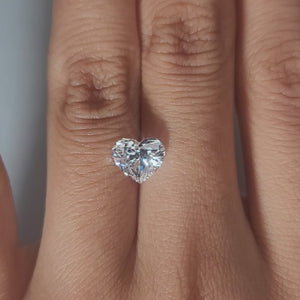 Close-up hand video showcasing 1.60ct heart diamond in soft indoor light