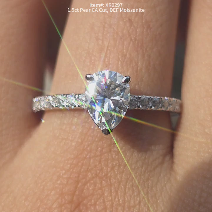 DovEggs Pear Crown arrow cut moissanite engagement ring sparkling in sunlight video.