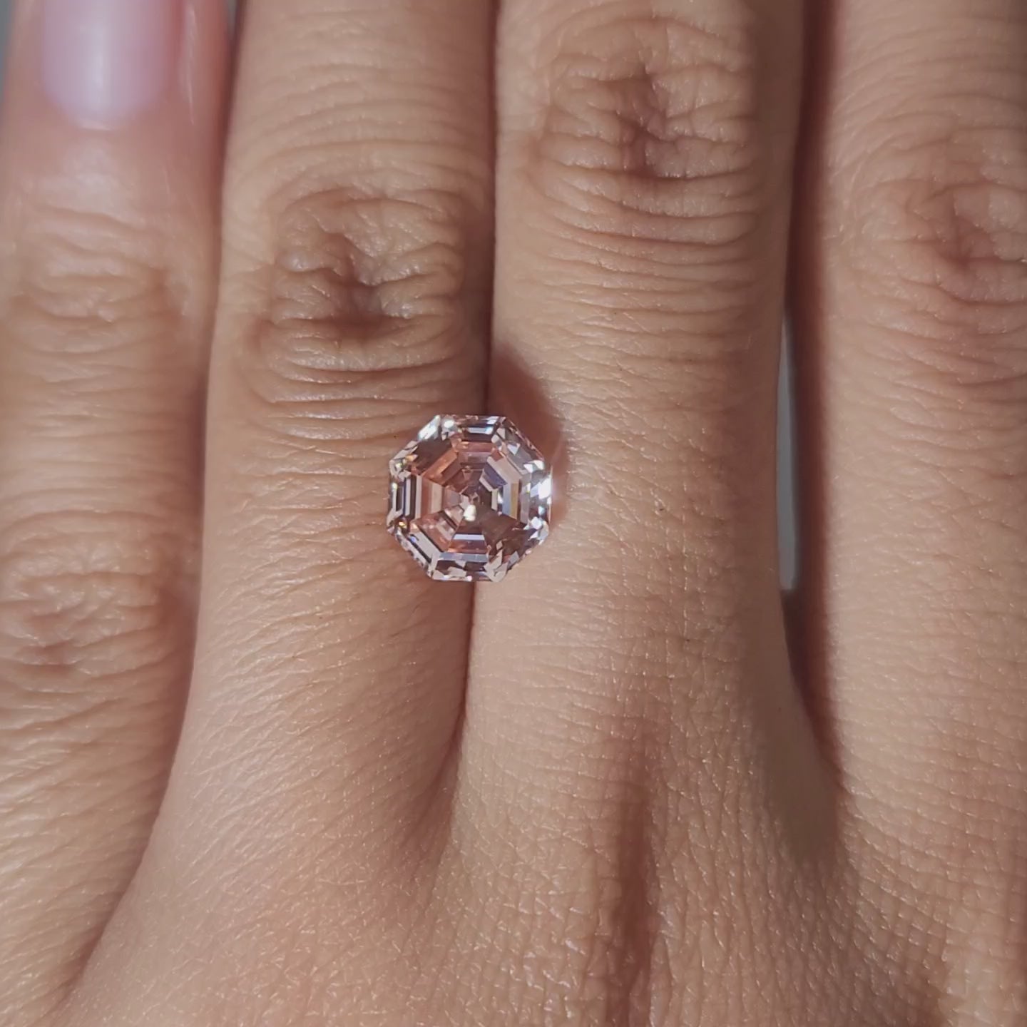 Designer jewelry video of 2.56ct pink octagon diamond in studio lighting