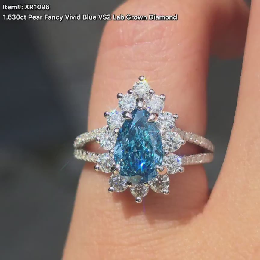 DovEggs pear blue lab diamond with halo moissanite accents engagement ring video in sunlight