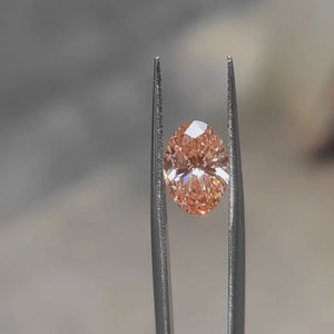 2.62ct Oval lab diamond radiating pink brilliance in sunlight