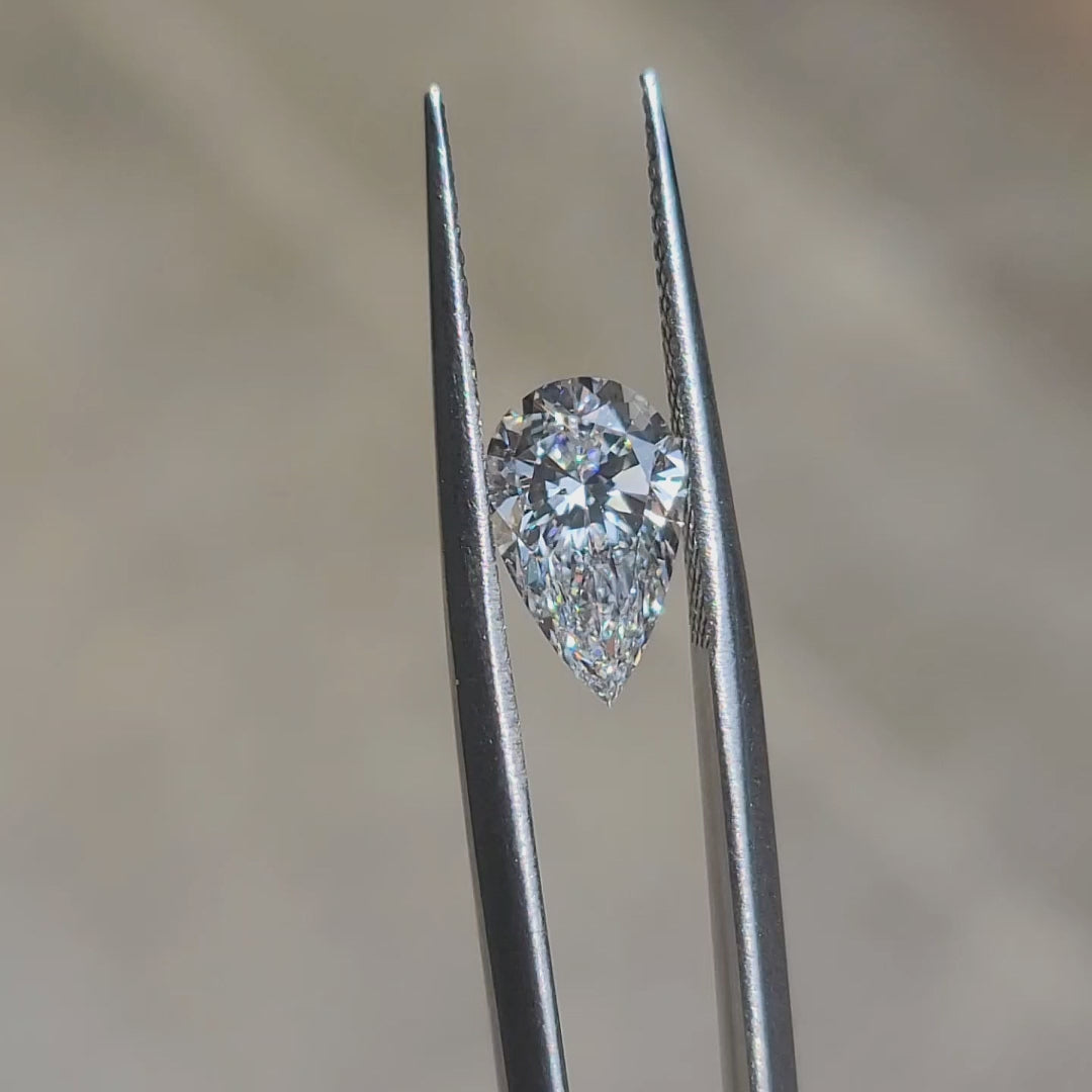 "Outdoor sunlight video highlighting 1.92ct pear cut’s sparkle and E color purity"