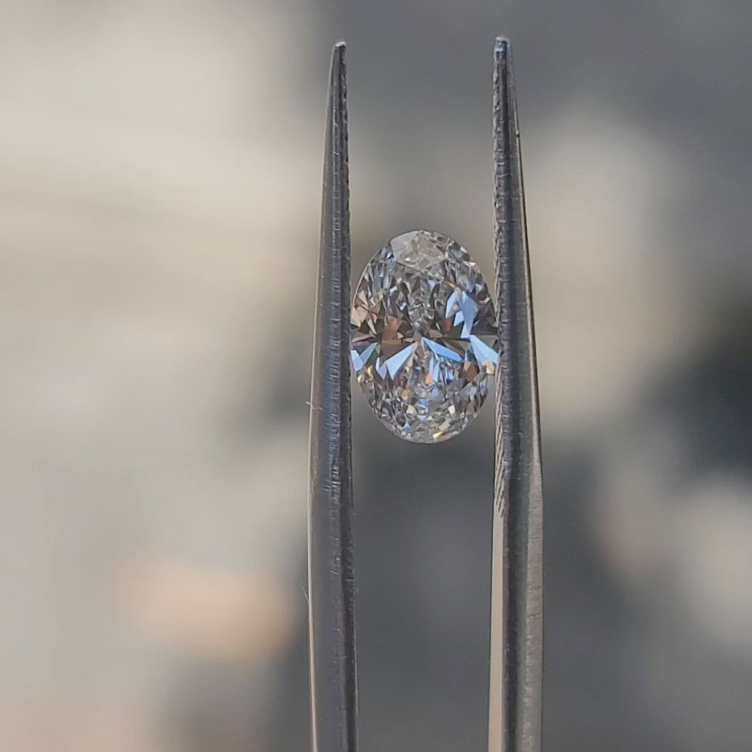 "Sunlight video showing 1.27ct oval cut diamond's brilliant fire and F color clarity"