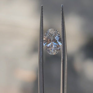 "Sunlight video showing 1.27ct oval cut diamond's brilliant fire and F color clarity"