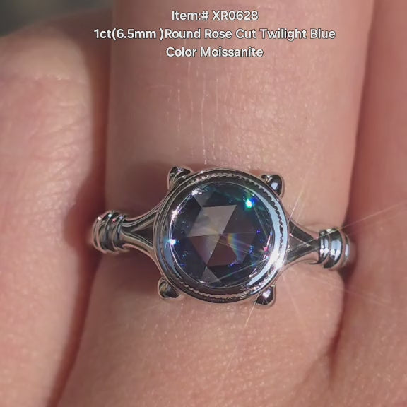 DovEggs Round rose cut twilight blue moissanite ring with bezle solitaire setting sparkling in sunlight video.