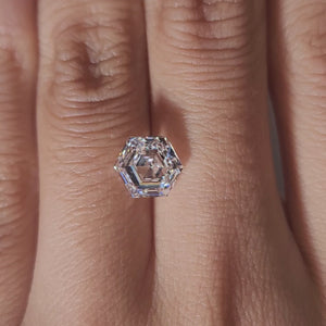 Hand-worn video of 2.495ct hexagon diamond in warm interior lighting