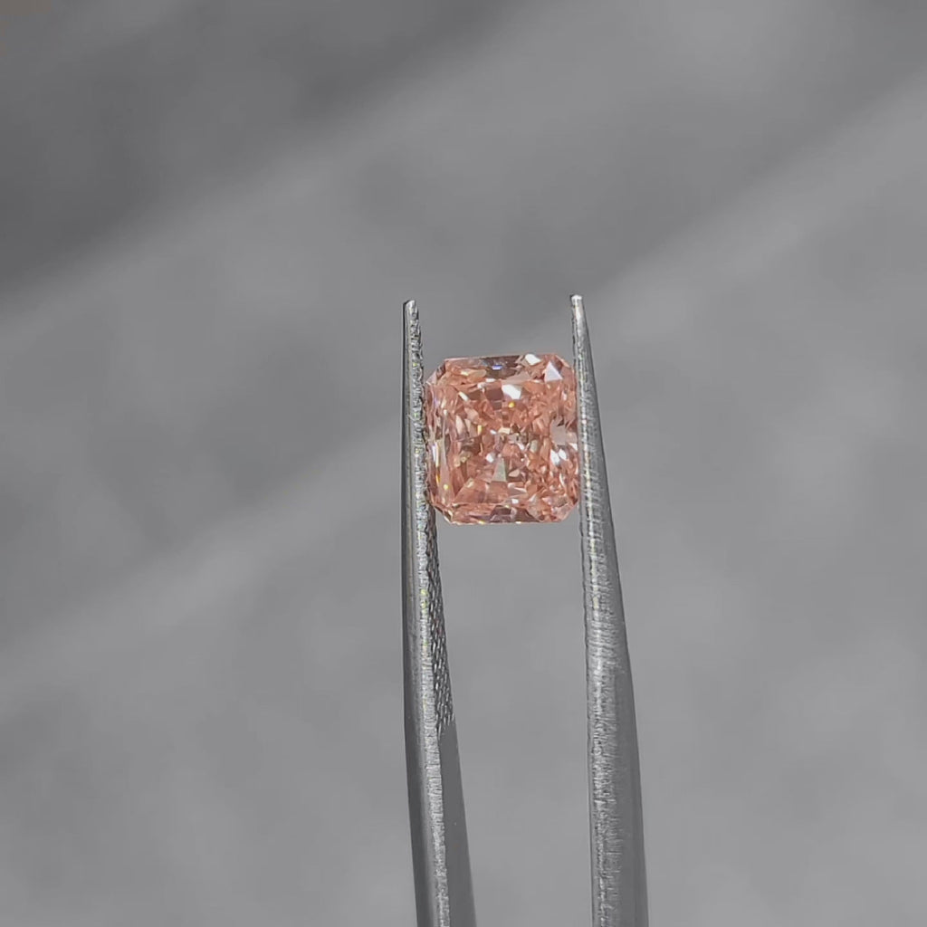 2.02ct radiant cut vivid pink diamond's color saturation in natural sunlight