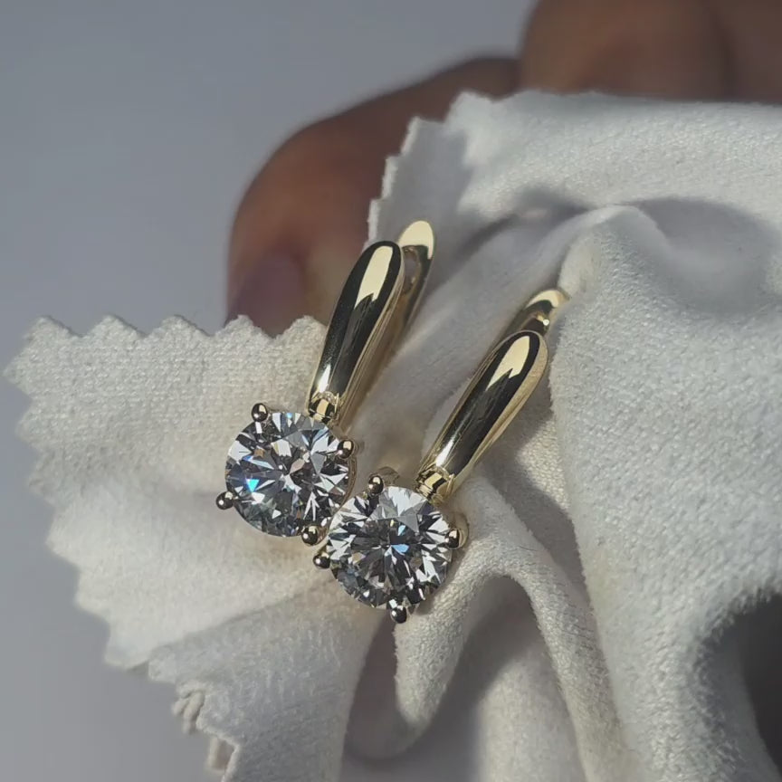 DovEggs round moissanite earring sparkling in sunlight video