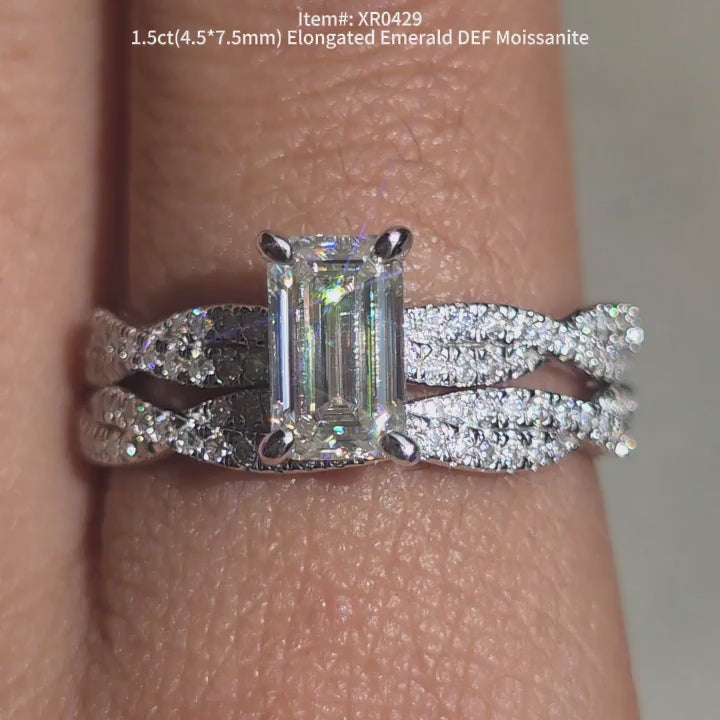 DovEggs DEF color Elongated emerald moissanite ring sparkling in sunlight video