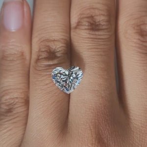 Hand-worn video showcasing heart shape in golden hour light