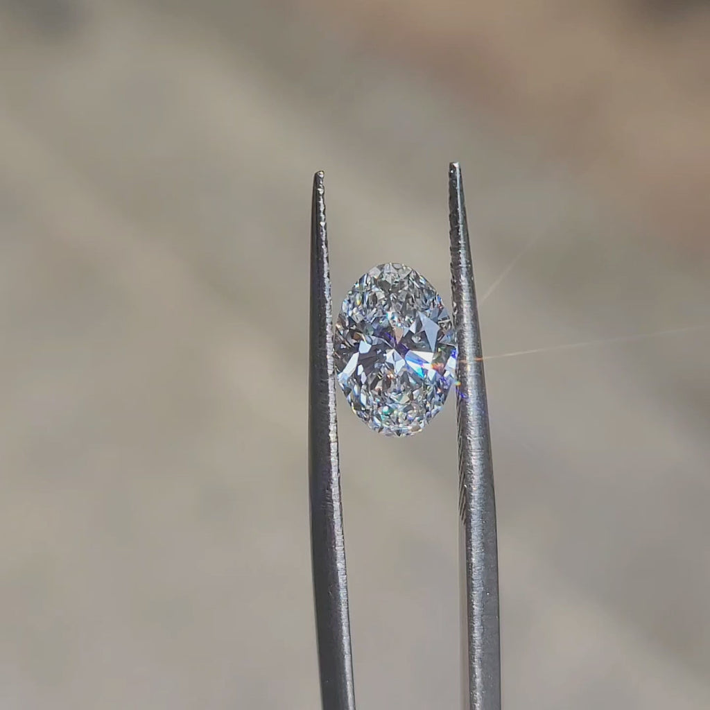 "Sunlight video showcasing 1.59ct oval cut lab diamond’s brilliance and D color clarity"