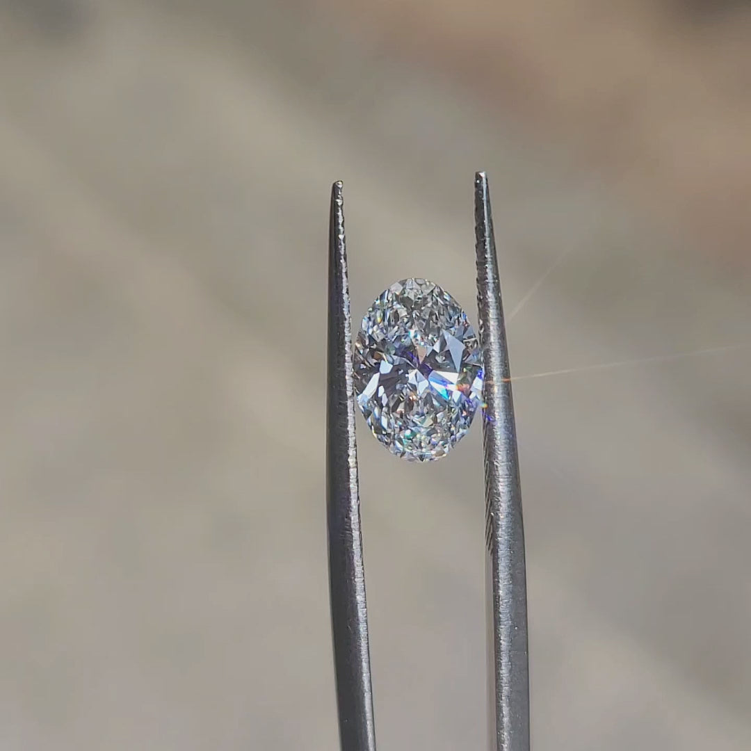 "Sunlight video showcasing 1.59ct oval cut lab diamond’s brilliance and D color clarity"