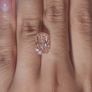 Hand-modeled video of 4.200ct pink cushion diamond under warm light