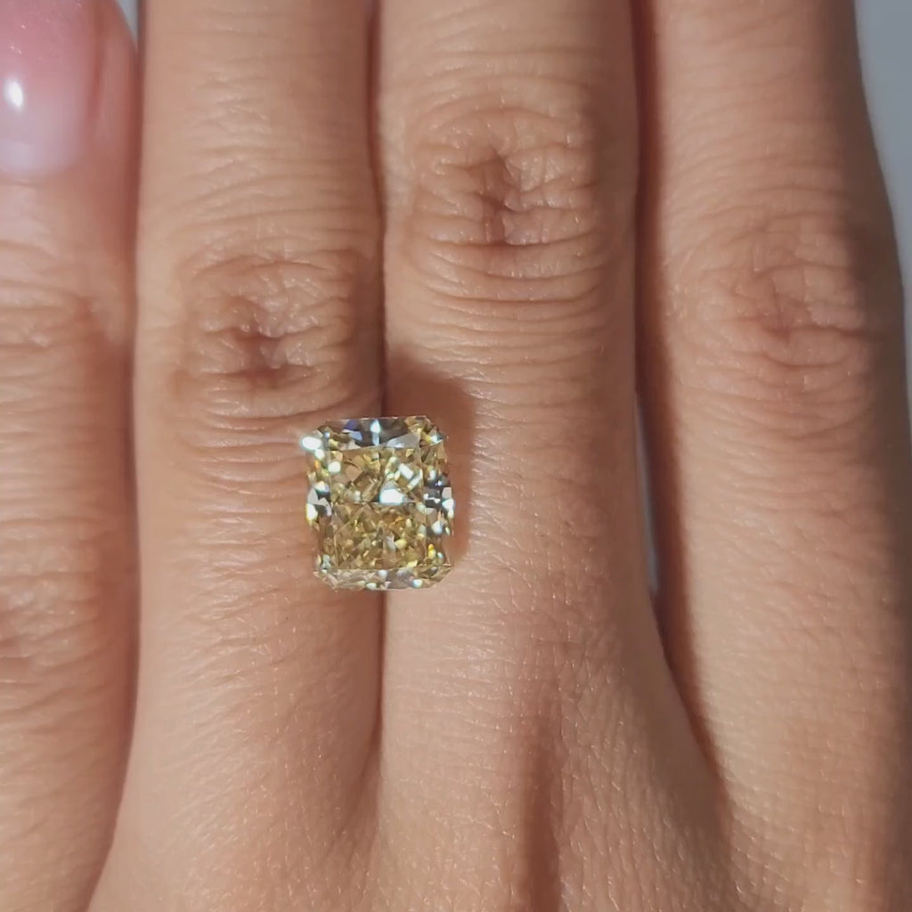 Close-up hand modeling showing diamond's size and sparkle