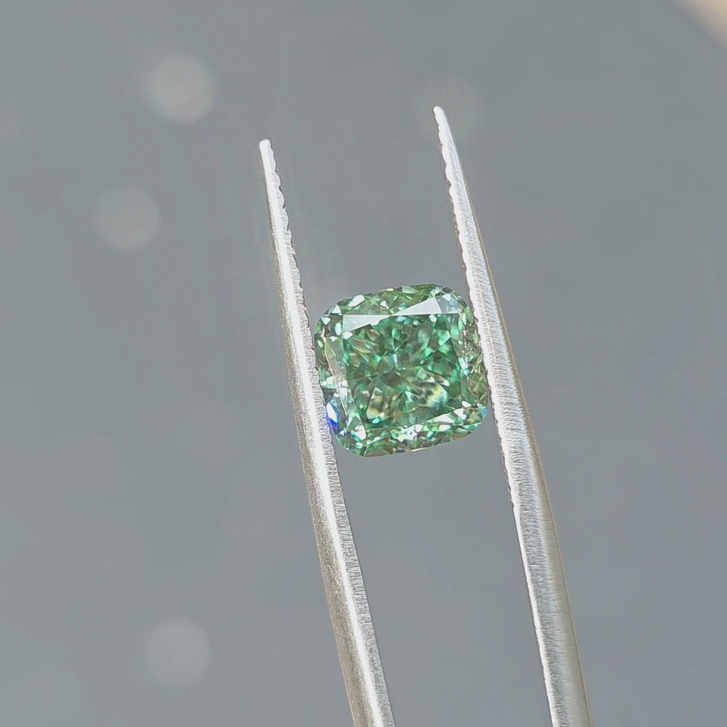 3.00ct cushion brilliant cut fancy vivid green VS1 lab diamond displaying vibrant color in outdoor sunlight.