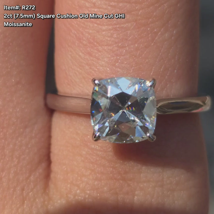 DovEggs Square cushion old mine cut moissanite ring sparkling in sunlight video.