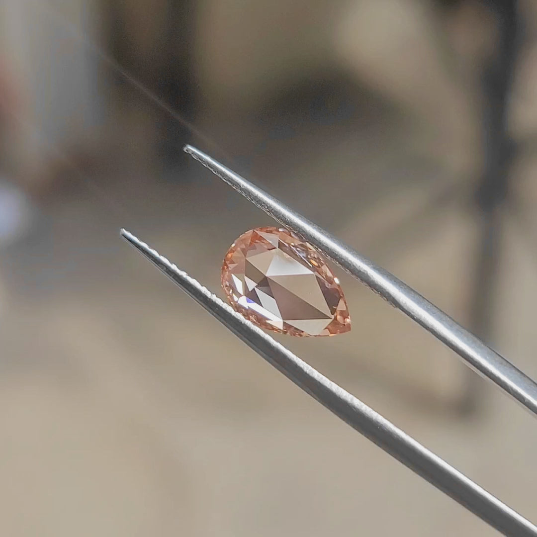 Outdoor video of 2.21ct pear rose cut's teardrop shape and pink brilliance"