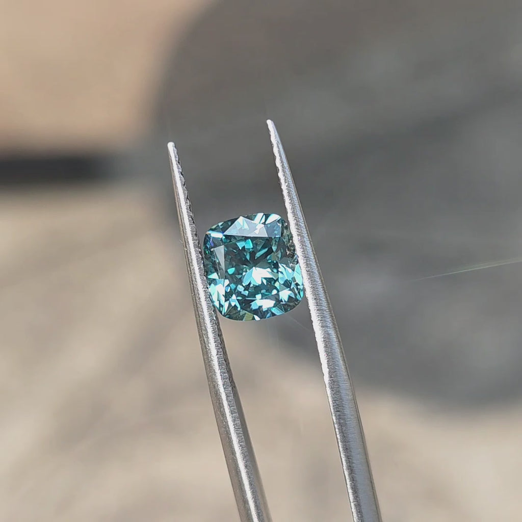 A 2.14ct cushion brilliant cut fancy vivid blue VVS1 lab diamond sparkles in sunlight.