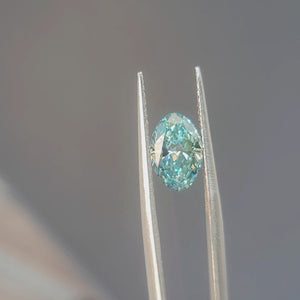 Sunlight video showing 2.03ct oval brilliant cut lab diamond's fancy vivid greenish blue sparkle
