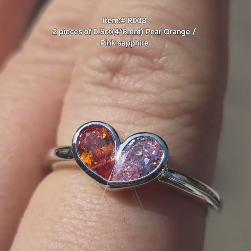 DovEggs pear orange sapphire pink sapphire ring sparkling in sunlight video