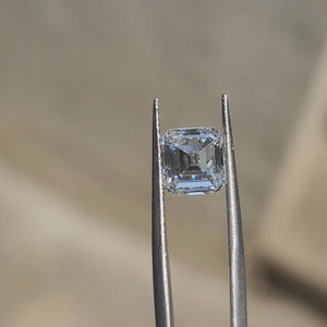 3.01ct Asscher lab diamond (D/VVS1) in direct sunlight, showing deep light performance