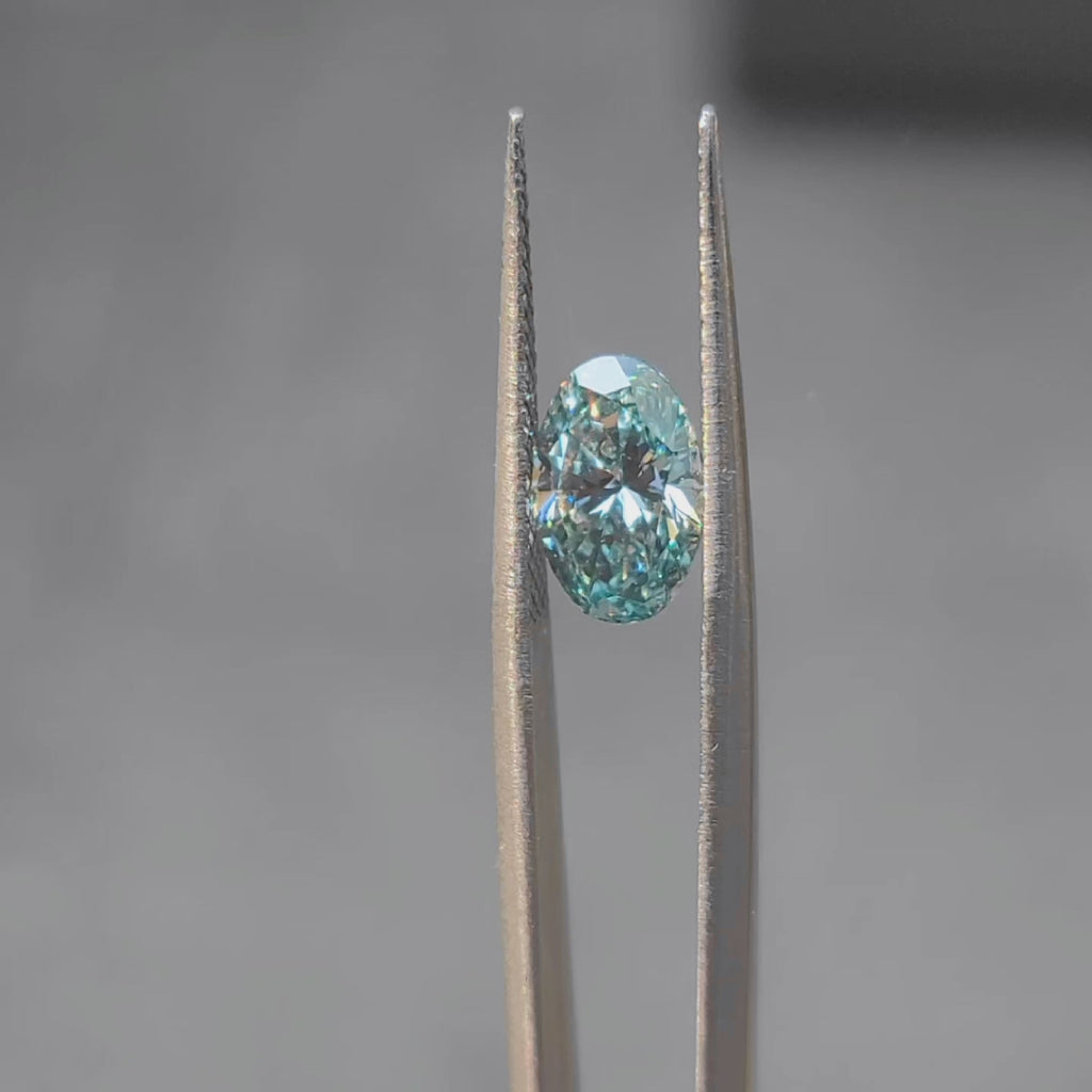 2.002ct oval fancy vivid blue diamond in sunlight, displaying intense color