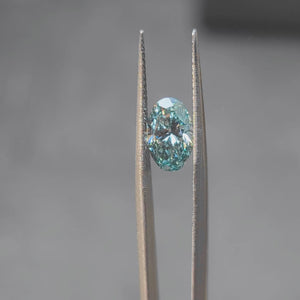 2.002ct oval fancy vivid blue diamond in sunlight, displaying intense color
