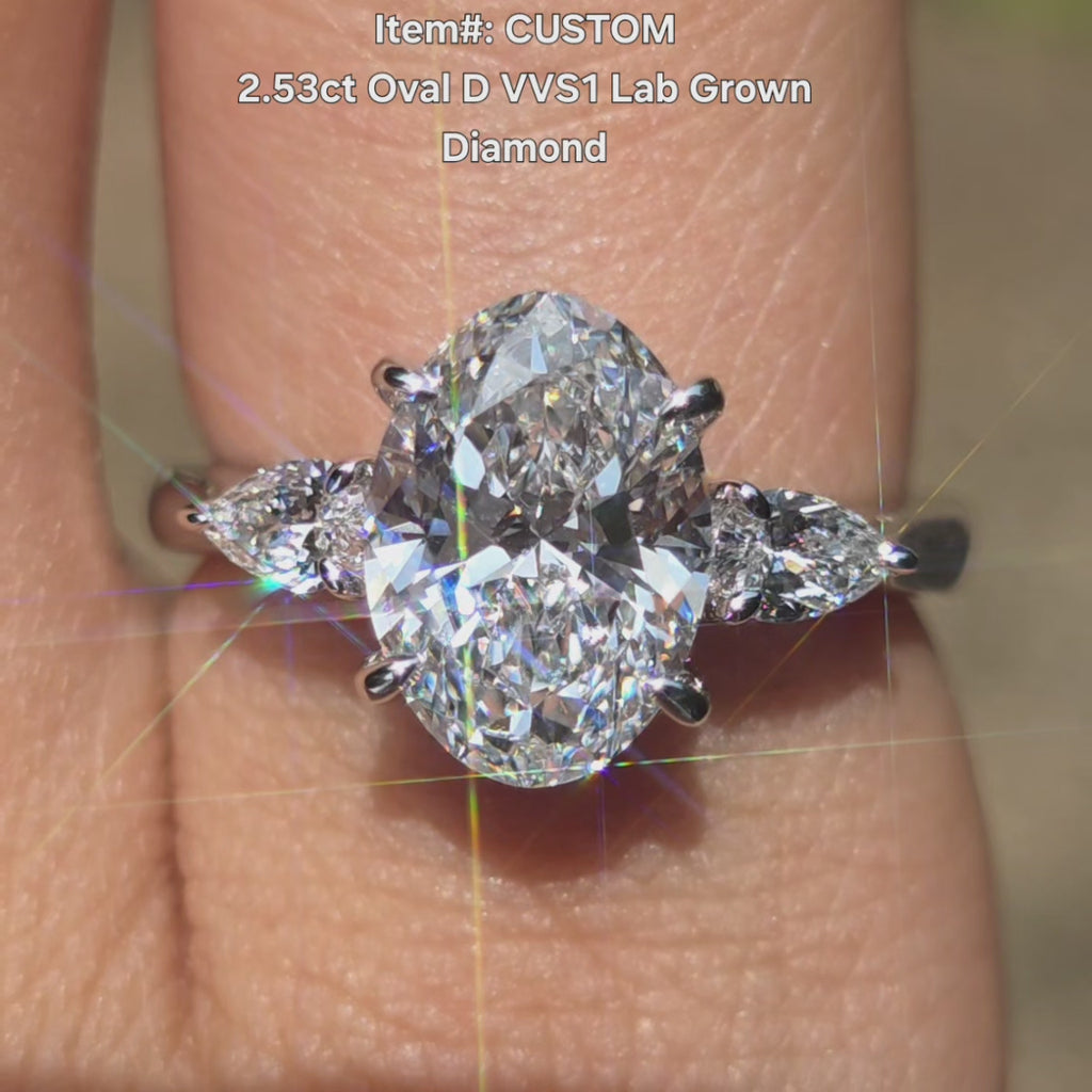 DovEggs oval side stones hidden halo lab diamond engagement ring in sunlight